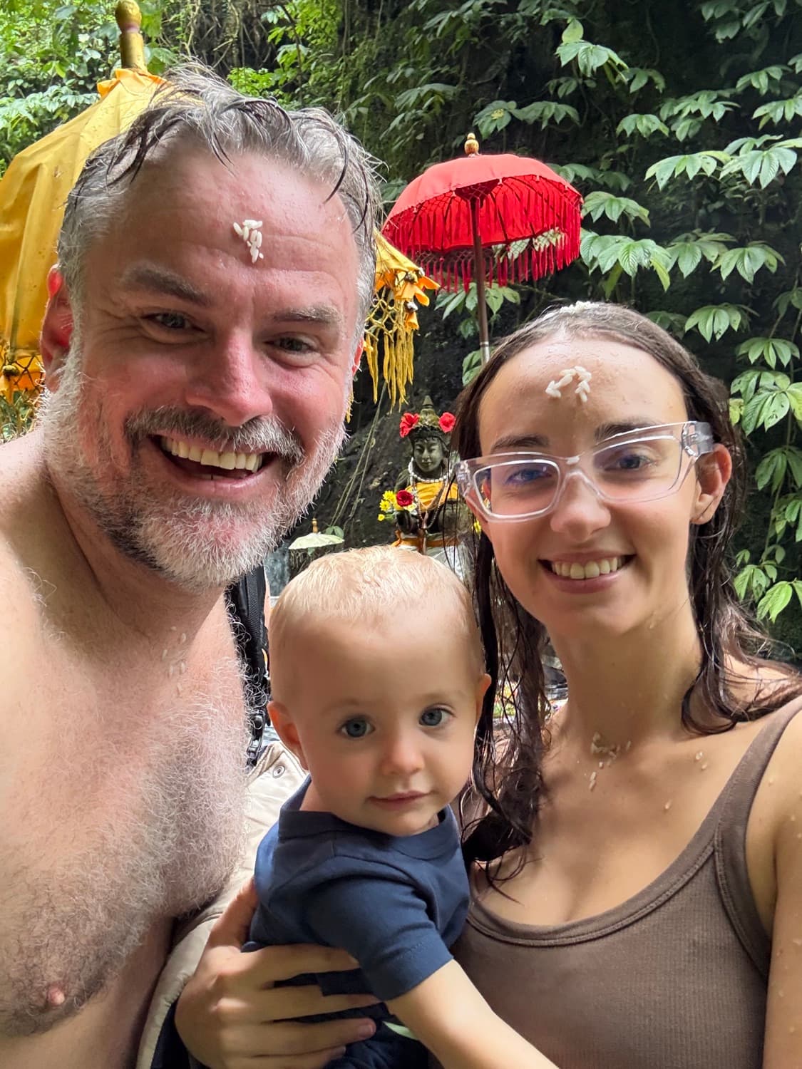 Shane, Nina and Delphi at a temple water blessing in Bali